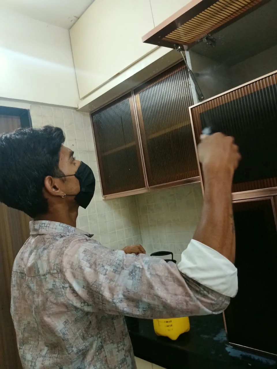 Professional pest-control treatment in a kitchen